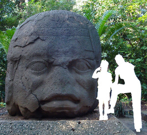 Gigantic Olmec head in Mexico, reminding of the first millenniun BC. The author of the photograph uploaded in 2008 to Vikiteka was indicated as Simon Burchell. Anonymous woman and girl's figures allows a better understanding of the size proportions. Like other surviving Olmec heads this one also has negroid facial features. Gigantic Olmec head in Mexico, reminding of the first millenniun BC. The author of the photograph uploaded in 2008 to Vikiteka was indicated as Simon Burchell. Anonymous woman and girl's figures allows a better understanding of the size proportions. Like other surviving Olmec heads this one also has negroid facial features.