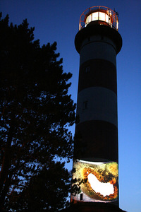 A. Maknytė's artistic act near Nida lighthouse during the photo artists' seminar. A. Maknytė's artistic act near Nida lighthouse during the photo artists' seminar.