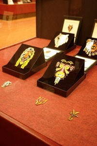 Gilded business presents – masks and magnets for the fridge. Photo by A.Masiokaitė Gilded business presents – masks and magnets for the fridge. Photo by A.Masiokaitė