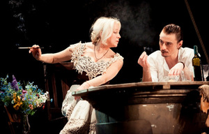 Demonic student Beliajev (Tomas Rinkūnas) sets a net on Natalja Petrovna (Inesa Paliulytė). Photo of NKDT Demonic student Beliajev (Tomas Rinkūnas) sets a net on Natalja Petrovna (Inesa Paliulytė). Photo of NKDT