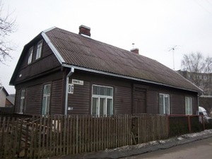 A house with semi-hip two-pitched roof A house with semi-hip two-pitched roof